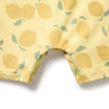 Close-up of a yellow fabric with lemon pattern on a white background