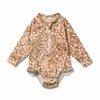 Floral-patterned baby romper on a white background