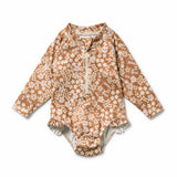 Floral-patterned baby romper on a white background