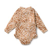 Floral-patterned baby romper on a white background