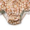 Floral-patterned underwear with ruffled edges on a white background