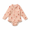 Pink baby onesie with strawberry pattern on a white background