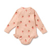 Pink baby onesie with strawberry pattern on a white background