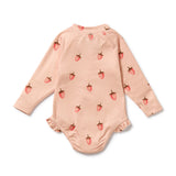 Pink baby onesie with strawberry pattern on a white background