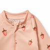 Pink baby onesie with strawberry patterns on a white background