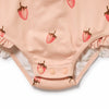 Pink baby onesie with strawberry pattern on a white background