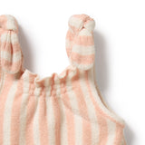Pink and white striped baby romper with bunny ears on a light background