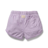 Lavender shorts with a textured surface on a white background