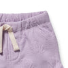 Close-up of purple textured pants with a white drawstring on a white background