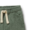 Green fleece pants with a cream drawstring on a white background