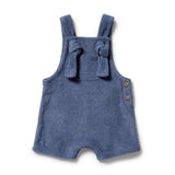 Blue baby romper with bow straps on a white background