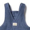 Blue children's apron with a visible brand label on a white background