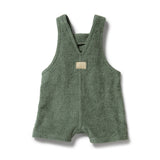 Green baby romper with a small patch on a white background