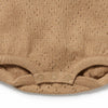 Close-up of a beige baby romper with textured pattern on a white background