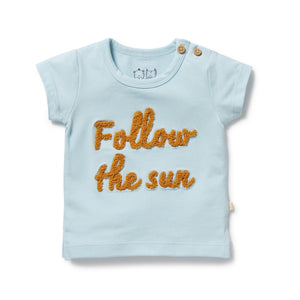 Light blue t-shirt with 'Follow the sun' text on a white background