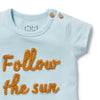Light blue baby onesie with 'Follow the sun' text in orange on a white background