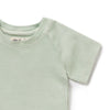 Light green t-shirt with a brand label on a white background