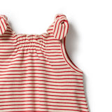 Close-up of a sleeveless children's top with thin red horizontal stripes on a cream base, featuring knotted shoulder ties and a gathered neckline, photographed on a white background.