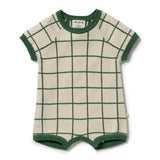 A baby knit romper in cream with a green windowpane grid pattern and green ribbed trim, shown flat on a white background.