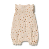 A sleeveless cream-colored baby romper with a small brown pattern, featuring ruffled shoulder straps and elasticized leg cuffs, shown flat on a white background.