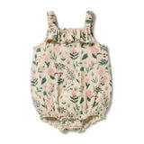 A baby bubble romper in a beige crinkle fabric with a green and pink floral print, featuring ruffled shoulder straps and a ruffled hem, shown flat on a white background.