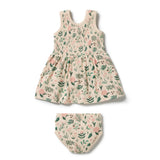 A two-piece baby outfit set consisting of a sleeveless smocked dress and matching bloomers, both in a textured cream fabric with a green and pink floral print, shown on a plain white background.