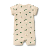 A cream-colored ribbed short-sleeve baby romper with an all-over green palm tree print, shown flat against a white background.