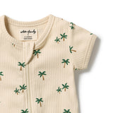 A close-up of a cream-colored ribbed short-sleeve baby top with a small green and brown palm tree print, featuring a snap closure at the collar.