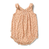 A baby sleeveless romper in a warm orange and cream gingham pattern with tiny brown square motifs, featuring ruffled shoulder straps and a ruffled hem.