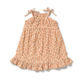 A sleeveless tiered baby dress with a small orange and white gingham pattern, featuring tie shoulder straps and a ruffled hem, shown on a plain white background.
