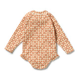 A long-sleeve baby bodysuit shown from the back, featuring an orange and cream gingham pattern with small red geometric accents, set against a plain white background.