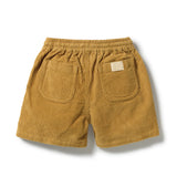 A pair of mustard yellow corduroy shorts with an elastic waistband, shown from the back. The shorts feature two large patch pockets, with one pocket displaying a small beige brand label.