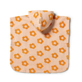 A hooded baby blanket or poncho in a warm peach-beige color, featuring an all-over pattern of orange flower motifs, shown flat against a white background.