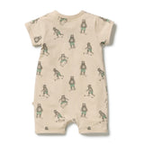 A short-sleeve baby romper in beige with an all-over print of cartoon bears playing soccer, shown flat against a white background.