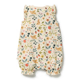 A sleeveless baby romper with a cream-colored background and an all-over colorful print of rabbits, birds, flowers, and small fruits, shown flat against a white background.