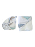 A baby muslin blanket set featuring a whale print, shown in both flat and folded configurations on a plain white background.