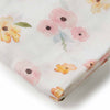 Floral-patterned fabric with pink and yellow flowers on a white background