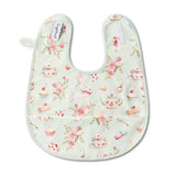 Floral and tea-themed baby bib on a white background