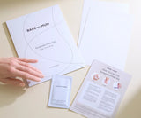 Bare Mum keepsake print kit with instructions and a hand holding a packet on a beige background