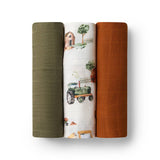 Three rolled-up fabrics with different patterns on a white background