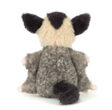 Plush toy possum on a white background