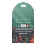 Back of retail packaging for a glow-in-the-dark octopus, showing product text, certification marks, a barcode, and underwater-themed graphics on a white background.
