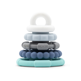 Stack of colorful baby teething rings on a white background