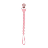 Pink pacifier clip on a white background