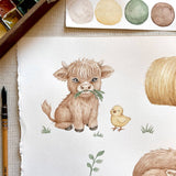 A watercolor-style illustration on white paper showing a fluffy light brown cow holding green grass and a small yellow chick, surrounded by painting tools and paint swatches.