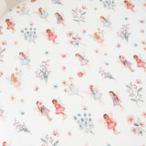 Pattern of fairies and flowers on a white background