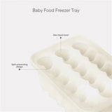 An off-white baby food freezer tray with multiple oval cavities, shown on a light gray background with text labels pointing out spill-preventing design and max liquid level.