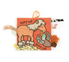 Children's soft book with animal illustrations on a white background