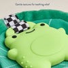 Green teething toy with checkered strap on a green background