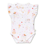 A white baby bodysuit with ruffled sleeves and a snap closure at the neck, featuring an all-over print of ice cream cones, cupcakes, ice cream trucks, and colorful sprinkles.